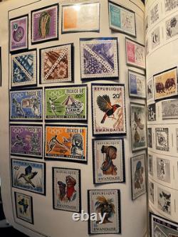 Imposante collection de plus de 7 000 timbres du monde entier, neufs et oblitérés, dans un album Citation