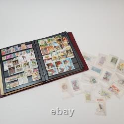 LOT Collection de Timbres Mondiale Neuve/Usagée Album USA Asie Afrique Europe+ dans Dossier