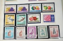 MONDE 1850-1970 COLLECTION A-C DE PLUS DE 6150 TIMBRES NEUFS ET USAGÉS DANS UN ALBUM HARRIS