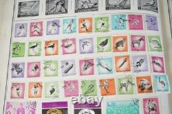 MONDE 1850-1970 COLLECTION A-C DE PLUS DE 6150 TIMBRES NEUFS ET USAGÉS DANS UN ALBUM HARRIS