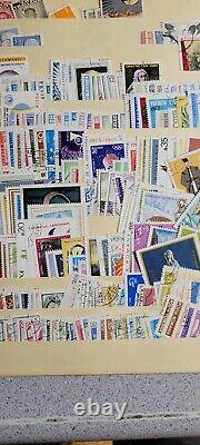 Milliers de timbres postaux européens et américains, tous anciens avec certains datant de