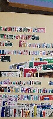 Milliers de timbres postaux européens et américains, tous anciens avec certains datant de