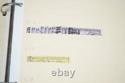Notre accumulation de plus de 2 500 timbres neufs et oblitérés, stockés dans un classeur sur des pages de stock.
