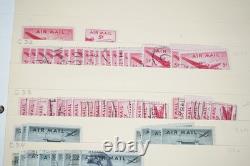 Notre accumulation de plus de 2 500 timbres neufs et oblitérés, stockés dans un classeur sur des pages de stock.