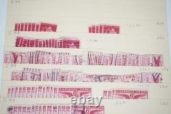 Notre accumulation de plus de 2 500 timbres neufs et oblitérés, stockés dans un classeur sur des pages de stock.