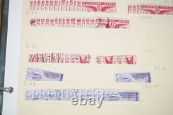 Notre accumulation de plus de 2 500 timbres neufs et oblitérés, stockés dans un classeur sur des pages de stock.
