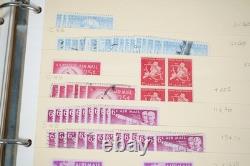 Notre accumulation de plus de 2 500 timbres neufs et oblitérés, stockés dans un classeur sur des pages de stock.