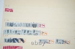 Notre accumulation de plus de 2 500 timbres neufs et oblitérés, stockés dans un classeur sur des pages de stock.
