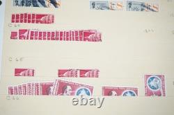 Notre accumulation de plus de 2 500 timbres neufs et oblitérés, stockés dans un classeur sur des pages de stock.