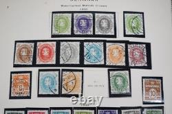 SCANDINAVIE 1870-ANNÉES 1970 COLLECTION DE PLUS DE 1 000 TIMBRES NEUFS ET OBLITÉRÉS DANS UN ALBUM SCOTT