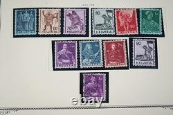 SUIISSE 1860-1970 COLLECTION DE PLUS DE 1 000 TIMBRES CONSERVÉS DANS UN ALBUM SCOTT